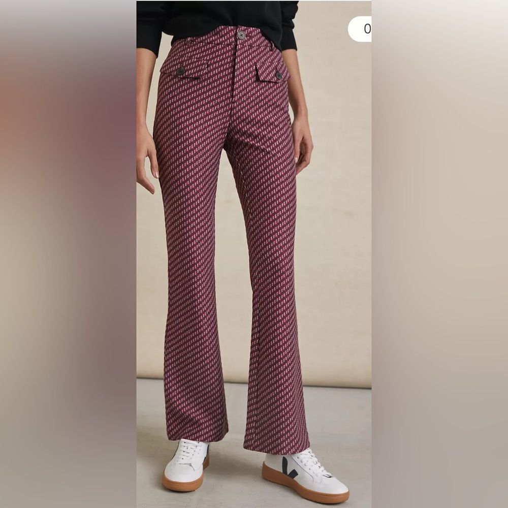 Anthropologie The Essential Slim Flared Pants with a burgundy patterned design